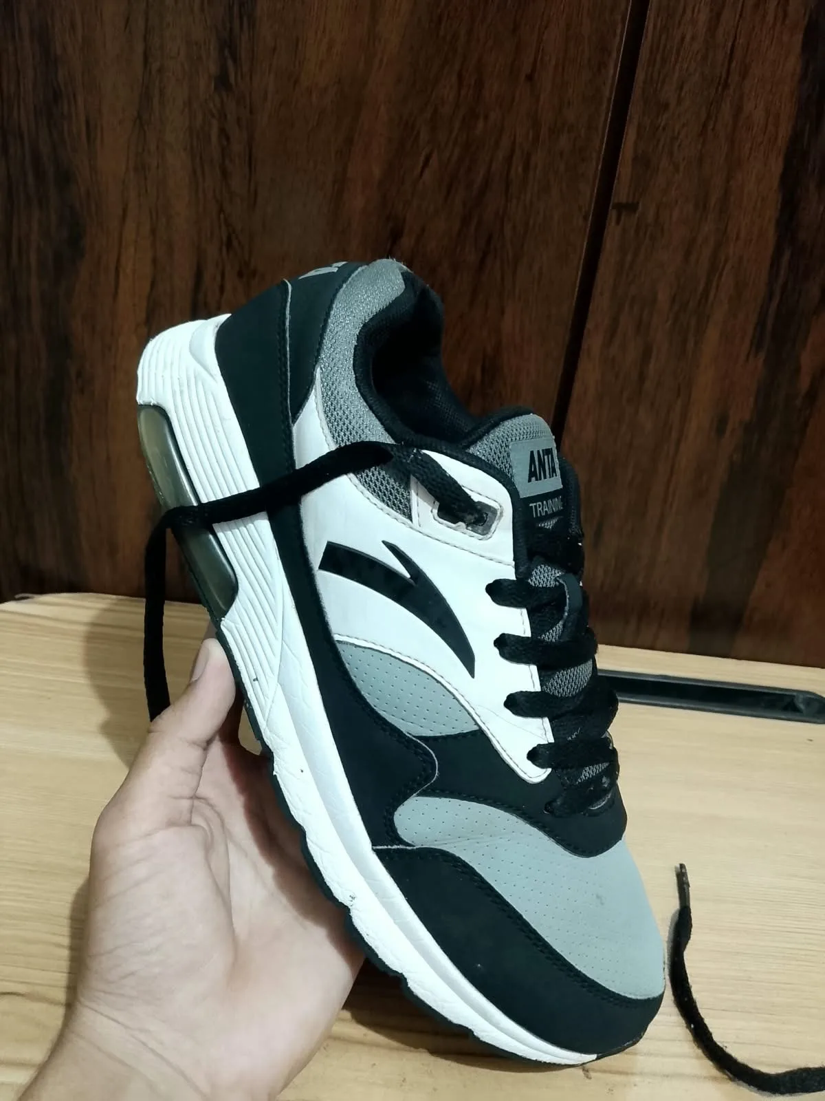 ANTA trainer, black and grey, side profile