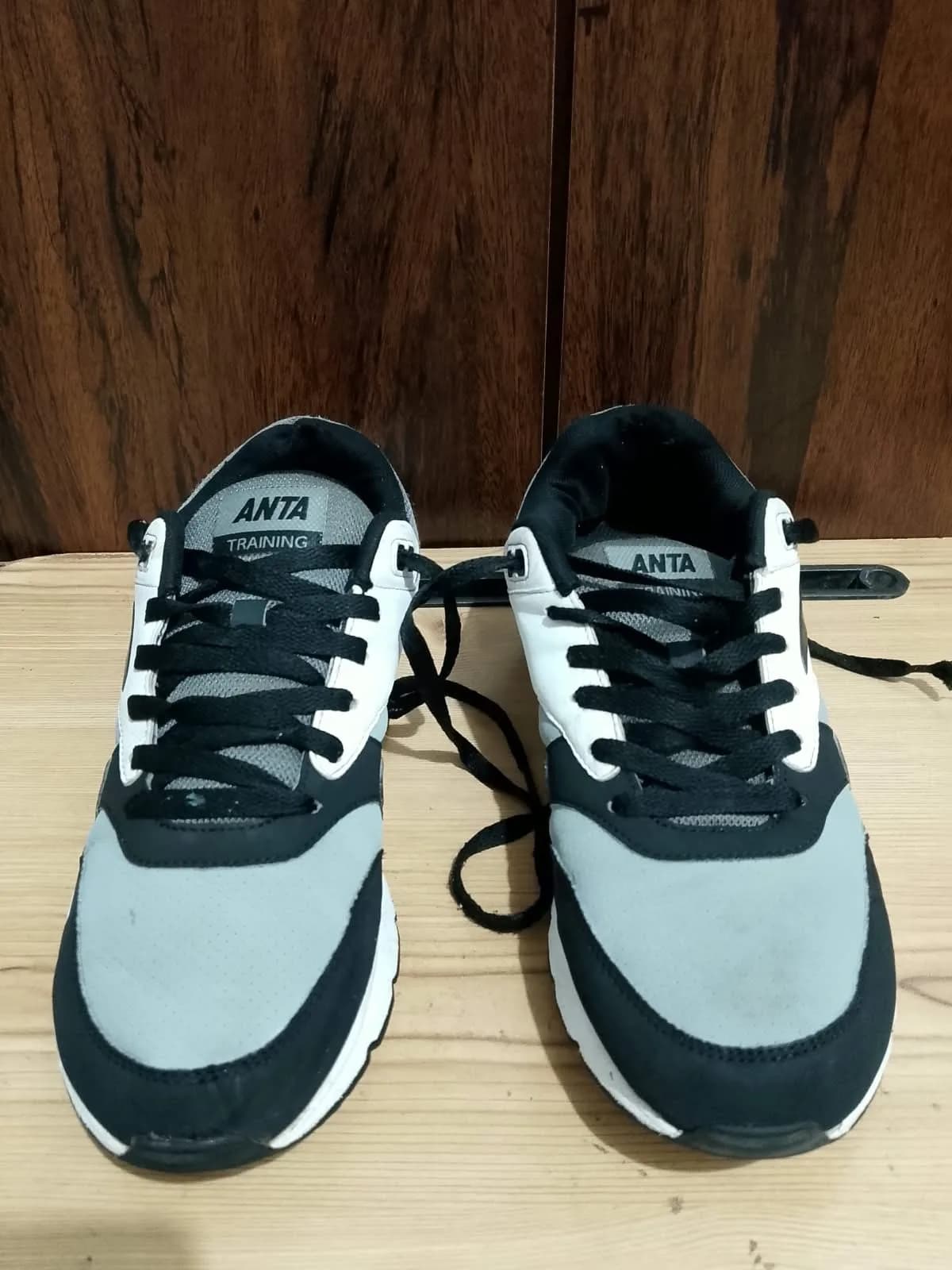 ANTA trainer, black and grey, pair front