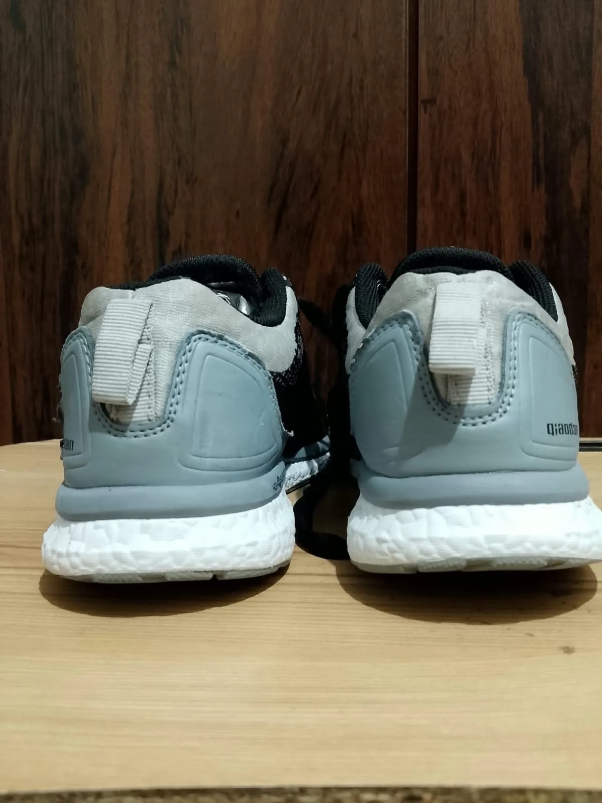 Running shoe, black and grey, sole