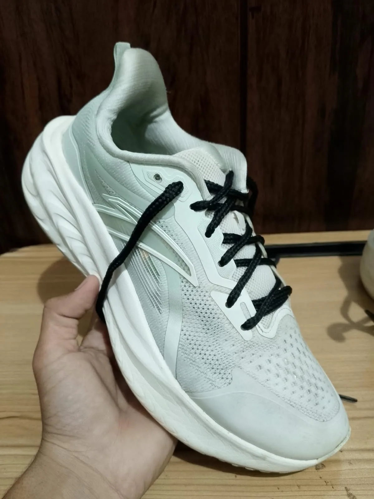 Running shoe, off white, side profile